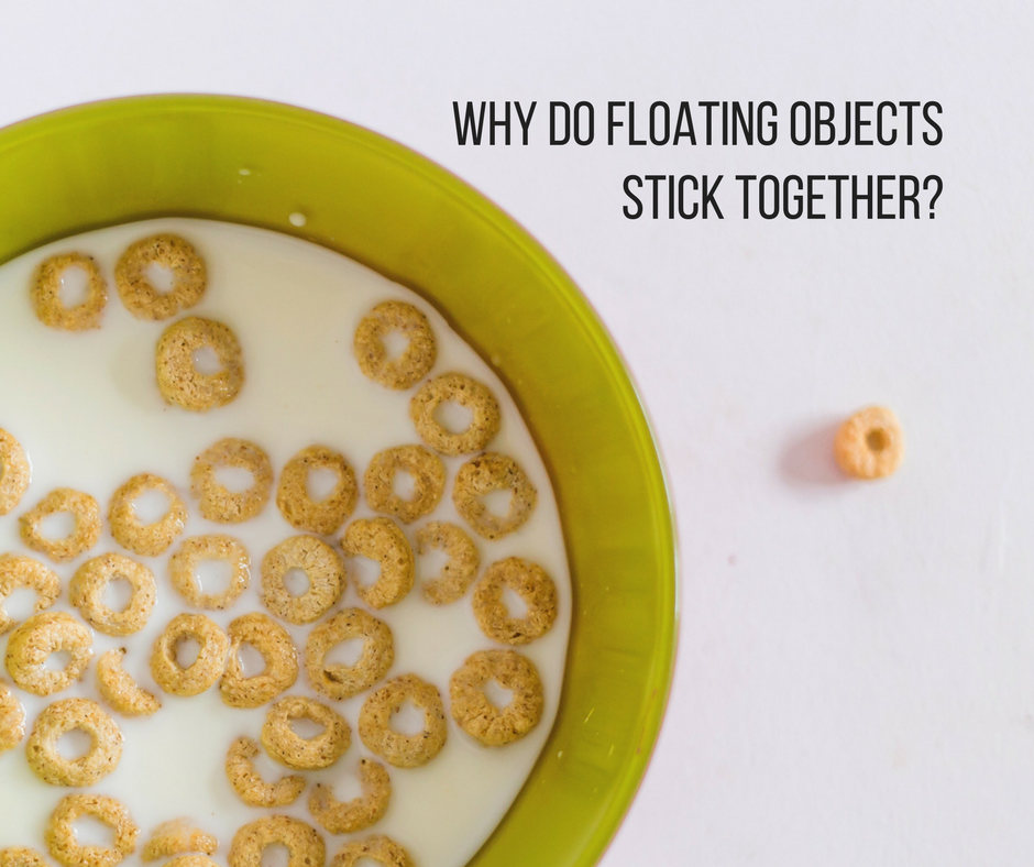 Why do floating objects stick together?